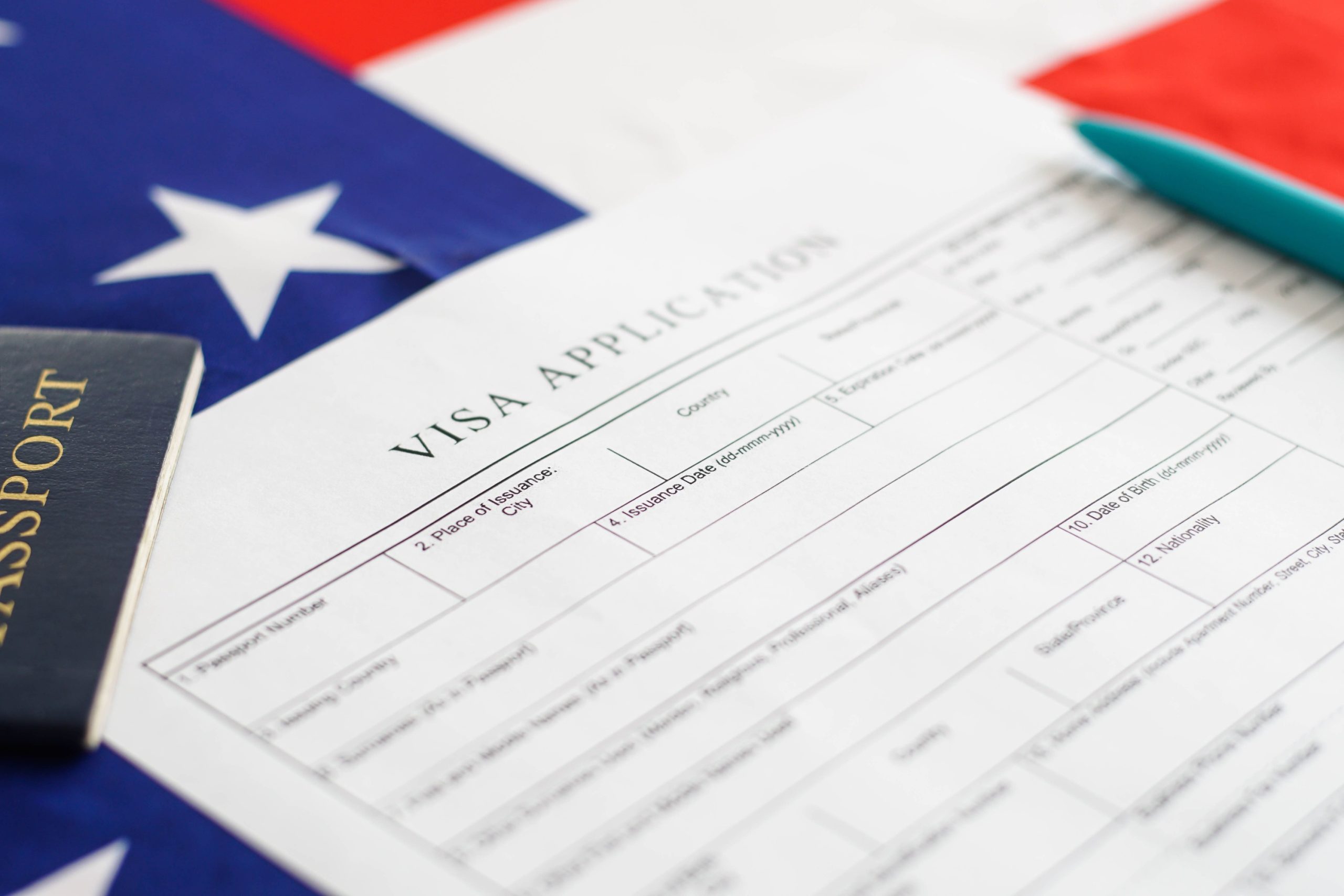 woman-filling-visa-application-form-american-flag-2026-03-10-00-02-28-utc-scaled.jpg